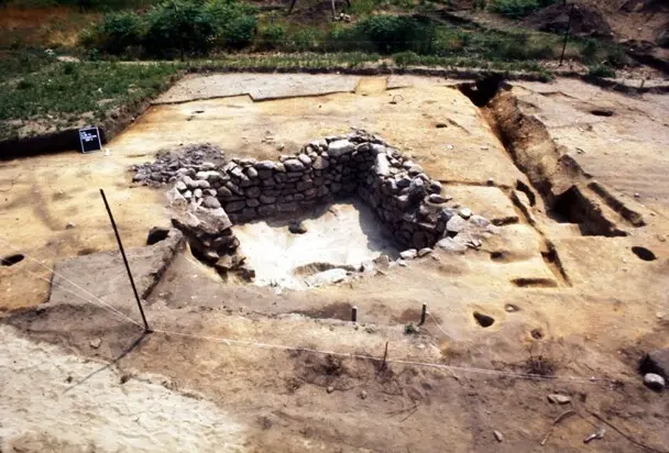 The stone base of a house uncovered on the Allerton-Cushman Site is sectioned off.