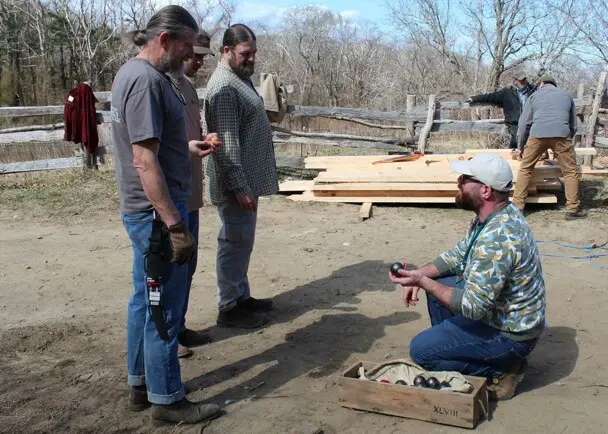 Volunteers staff talking village clean up day