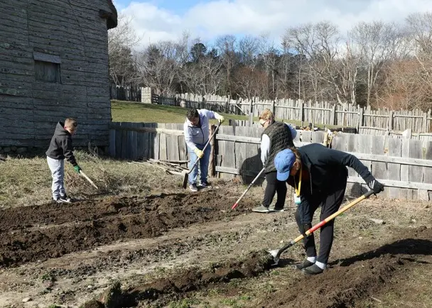 Volutneers garden village clean up day