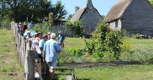 Members tour gardens of the 17th-Century English Village.