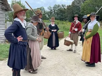 Pilgrims gather colony street