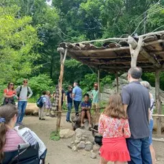 Museum guests speak with an educator on the Historic Patuxet Homesite