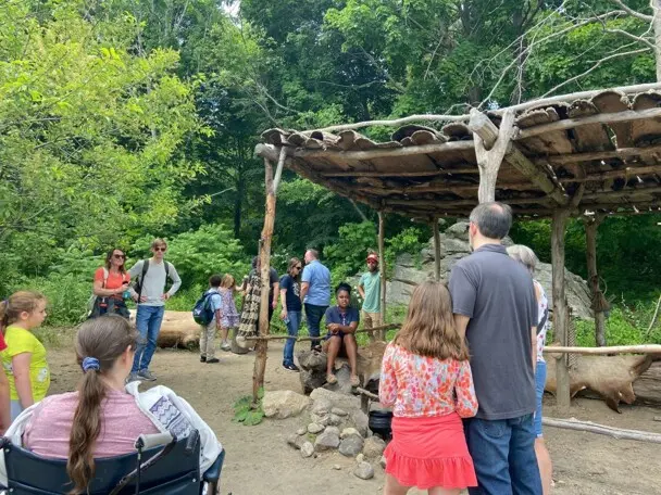 Museum guests speak with an educator on the Historic Patuxet Homesite