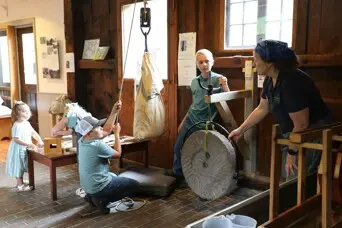 Grist mill educational exhibit guests educator