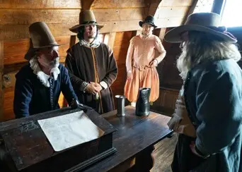 Pilgrims aboard mayflower signing compact