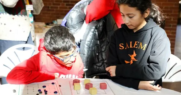 Eventbrite Header kids playing at table October