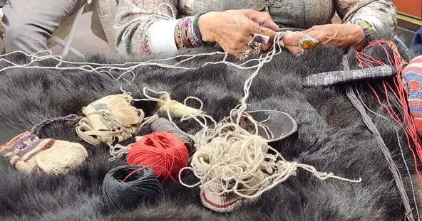 Indigenous Museum Educator demonstrates Indigenous craft