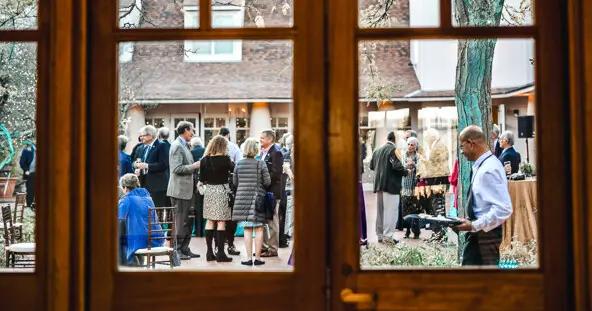 Crowd in courtyard through window