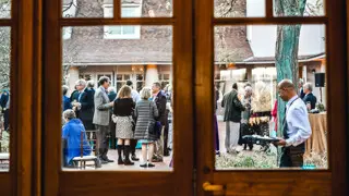 Crowd in courtyard through window