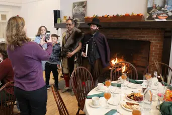 Thanksgiving dining family fireplace picture