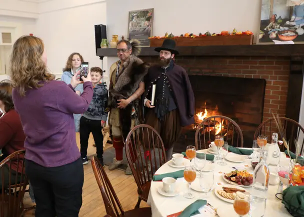 Thanksgiving dining family fireplace picture