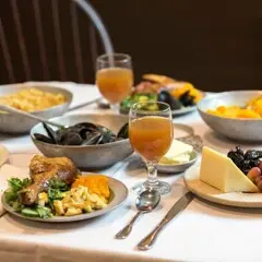 Thanksgiving table set with food inspired by historical recipes