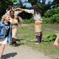 Guests and Educators take part in a traditional Wampanoag dance on the Homesite.