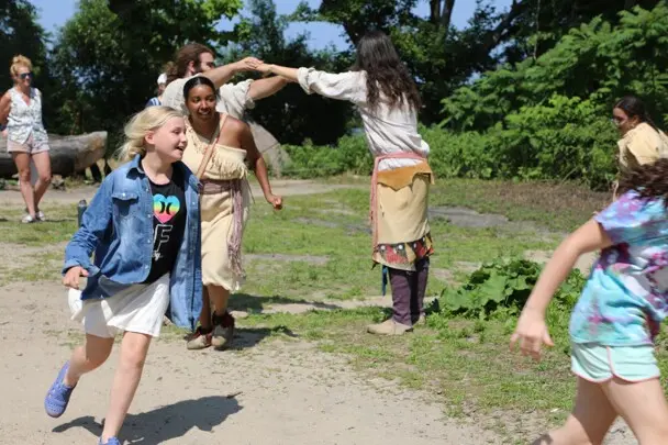 Guests and Educators take part in a traditional Wampanoag dance on the Homesite.