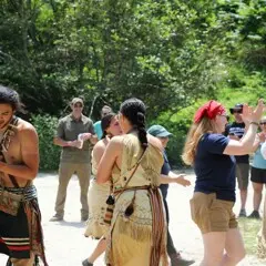 Educators demonstrate a traditional Wampanoag dance in front of guests at the Homesite on Strawberry Thanksgiving