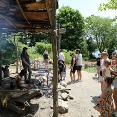 Guests gather at the cooking arbor on Strawberry Thanksgiving