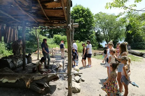 Guests gather at the cooking arbor on Strawberry Thanksgiving