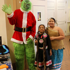 The Grinch poses with two young members of Wetu Ways.