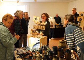 Guests at the Winter Fine Arts & Craft Fair shop handmade pottery.
