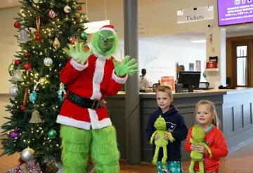 Kids pose with the Grinch