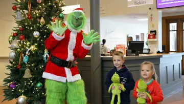 Kids pose with the Grinch