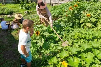 Children and pilgrims in garden
