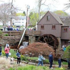 Guests walk the entrance path to Plimoth Grist Mill in early Spring.
