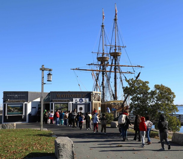 Students line up at the blue entrance building of Mayflower II.