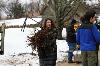 Cleaning leaves sticks village