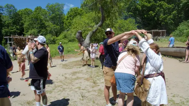 Guests and Culture Keepers participate in a traditional Wampanoag dance on the Historic Patuxet Homesite