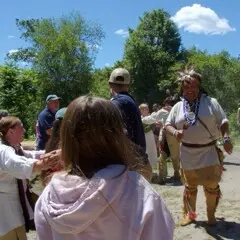 Culture keepers and guests on the Historic Patuxet Homesite engage in a traditional Wampanoag dance