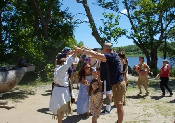 Guests participate in traditional Wampanoag dance on the Historic Patuxet Homesite