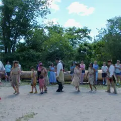 Culture keepers demonstrate a traditional Wampanoag dance on the Historic Patuxet Homeiste before guests.