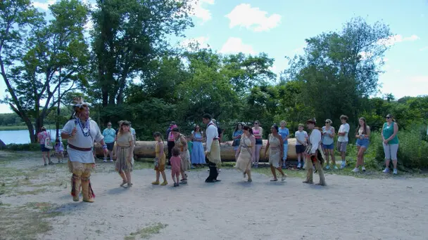 Culture keepers demonstrate a traditional Wampanoag dance on the Historic Patuxet Homeiste before guests.