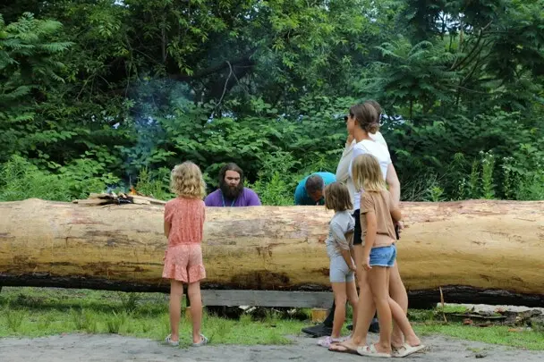 Guests stop to speak with Educators conducting the mishoon burn