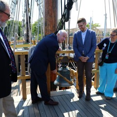 Sir Lindsay Hoyle ring the Mayflower Bell on the top deck of Mayflower II