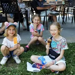 Three young girls enjoy ice cream at Member Appreciation Day.