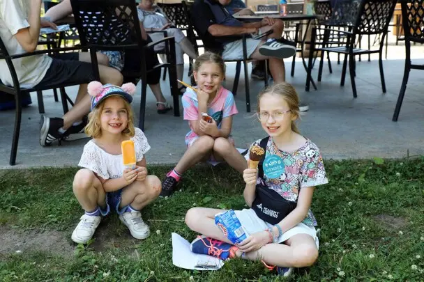 Three young girls enjoy ice cream at Member Appreciation Day.