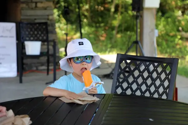 Young boy east ice cream treat