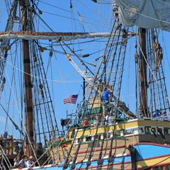 Mayflower tug boat american flag crew aloft