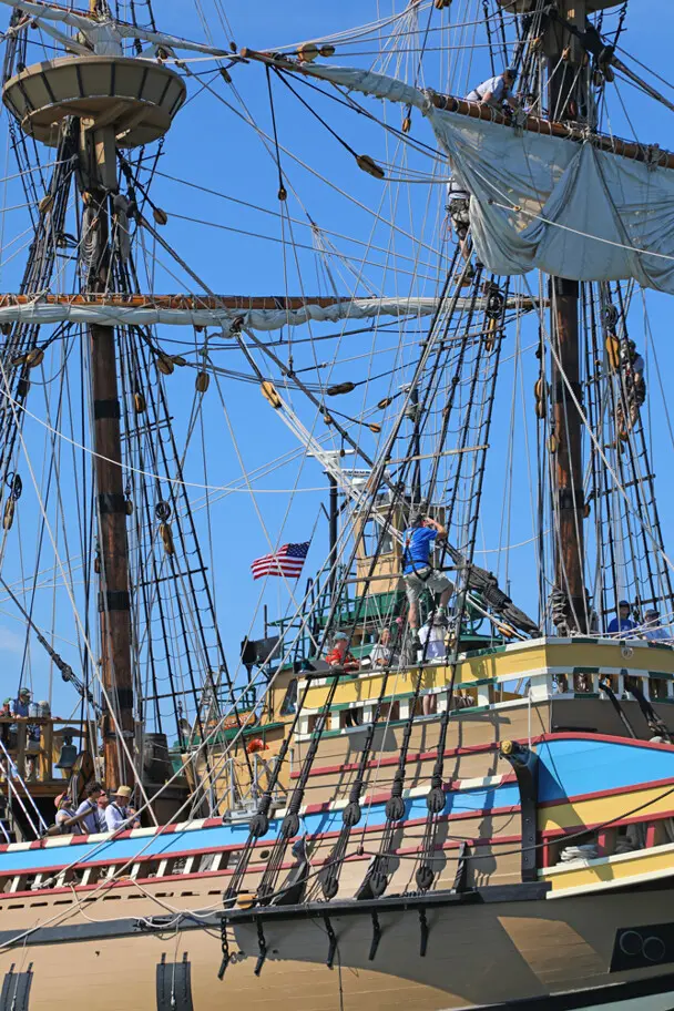 Mayflower tug boat american flag crew aloft