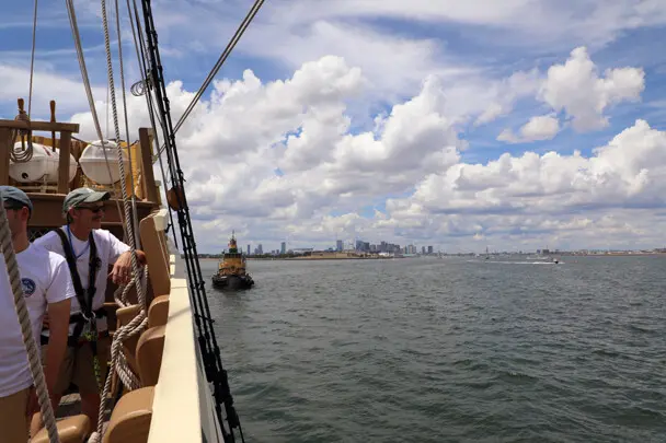 Mayflower tug boat boston harbor city skyline