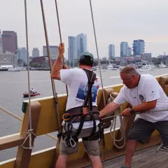 Sail boston 2026 sunset sail boston crew working lines skyline