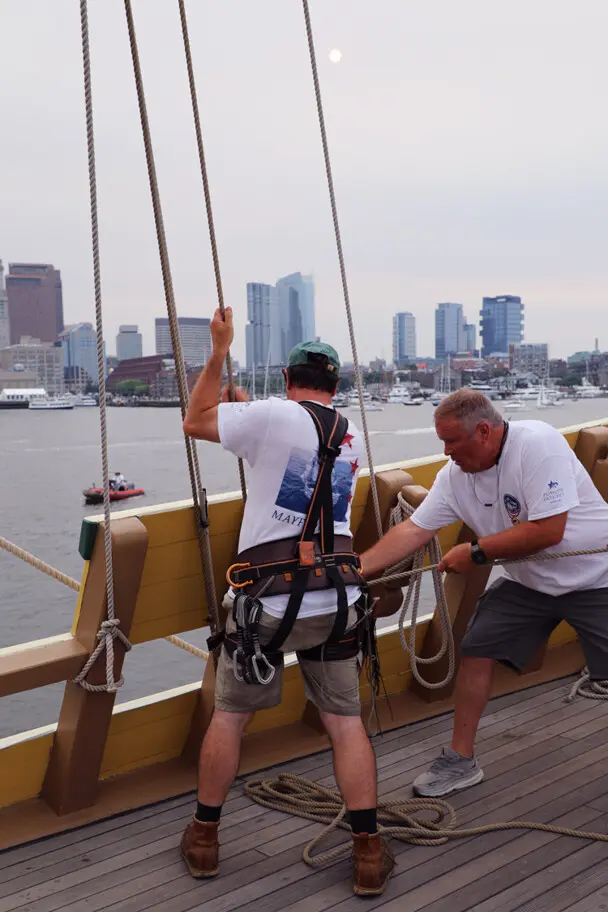 Sail boston 2026 sunset sail boston crew working lines skyline