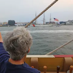 Sail boston 2026 sunset sail boston guest waving