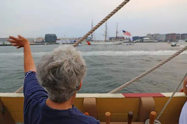 Sail boston 2026 sunset sail boston guest waving
