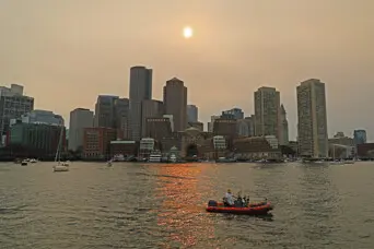 Sail boston 2026 sunset sail red boat boston skyline