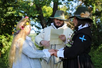 Pilgrim bride and groom are married by a magistrate.
