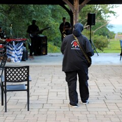 The Lead singer of The GroovaLottos walks amongst the auidence as he peforms.