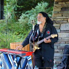Lead singer of The GroovaLottos balnces playing the guitar and the keyboard.